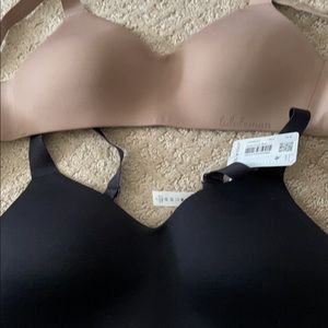 Brand new never worn hold true lululemon bras! One black color one nude 34B